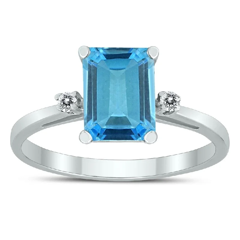 Emerald Cut 8X6MM Blue Topaz and Diamond Three Stone Ring in 10K White Gold