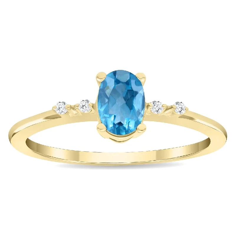 Women's Oval Shaped Blue Topaz and Diamond Sparkle Ring in 10K Yellow Gold