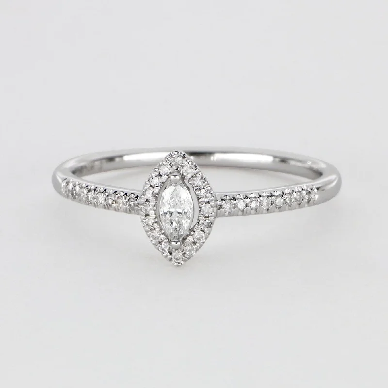 1/5ct TDW Marquise Shape Diamond Halo Ring in 10k Gold by De Couer