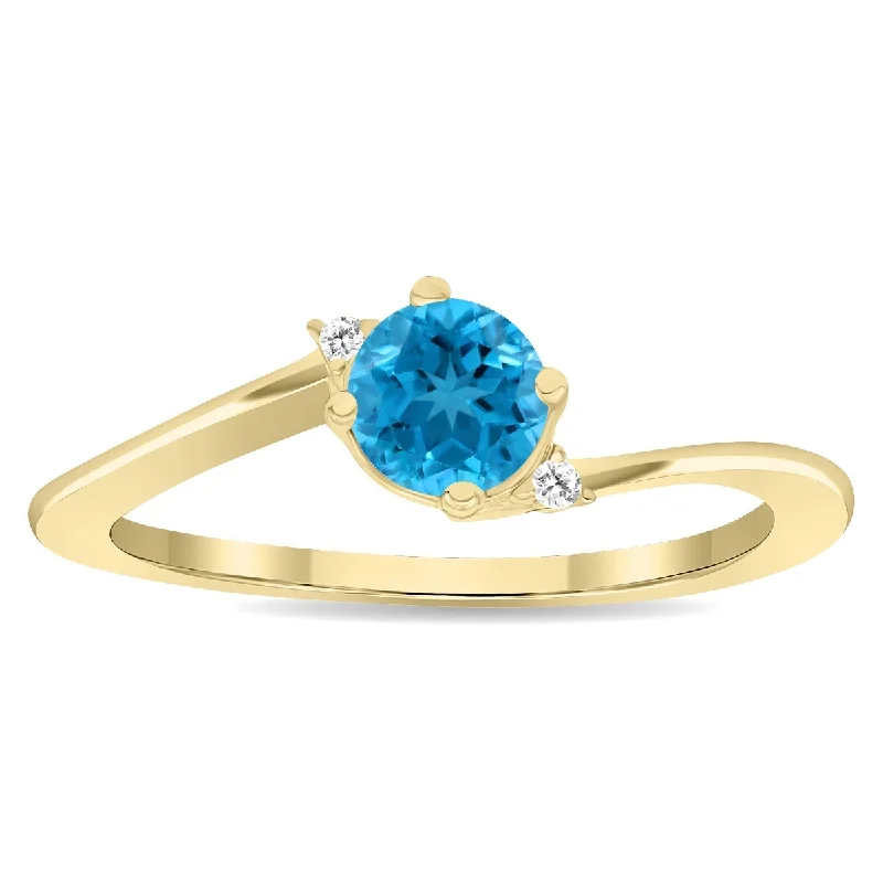 Women's Round Shaped Blue Topaz and Diamond Wave Ring in 10K Yellow Gold