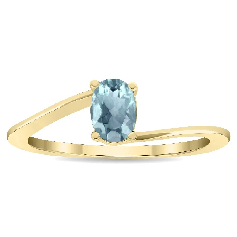 Women's Solitaire Oval Shaped Aquamarine Wave Ring in 10K Yellow Gold