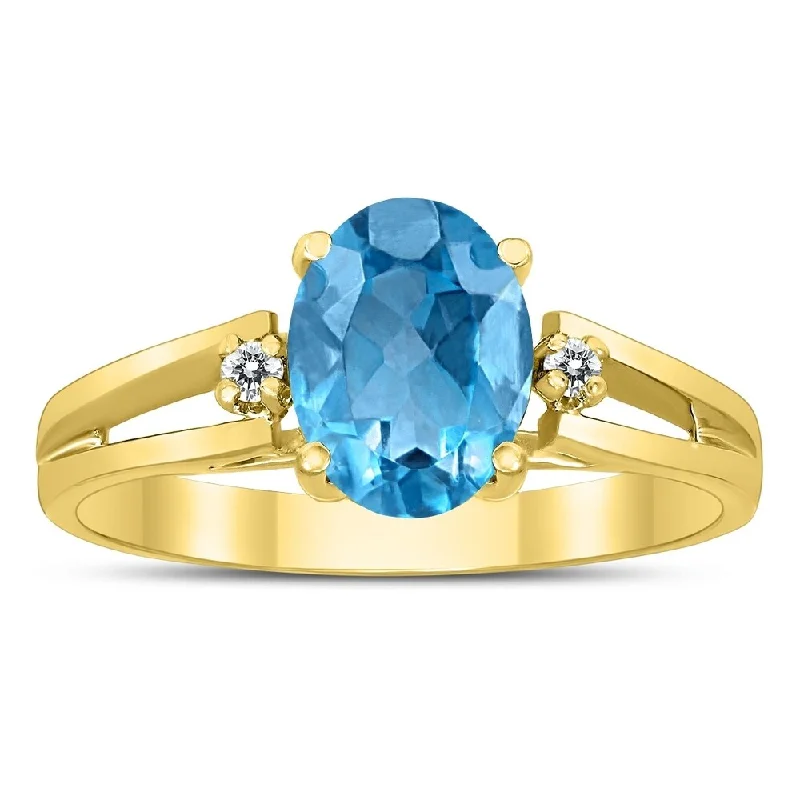 8X6MM Blue Topaz and Diamond Open Three Stone Ring in 10K Yellow Gold