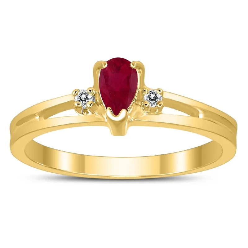 5X3MM Ruby and Diamond Pear Shaped Open Three Stone Ring in 10K Yellow Gold