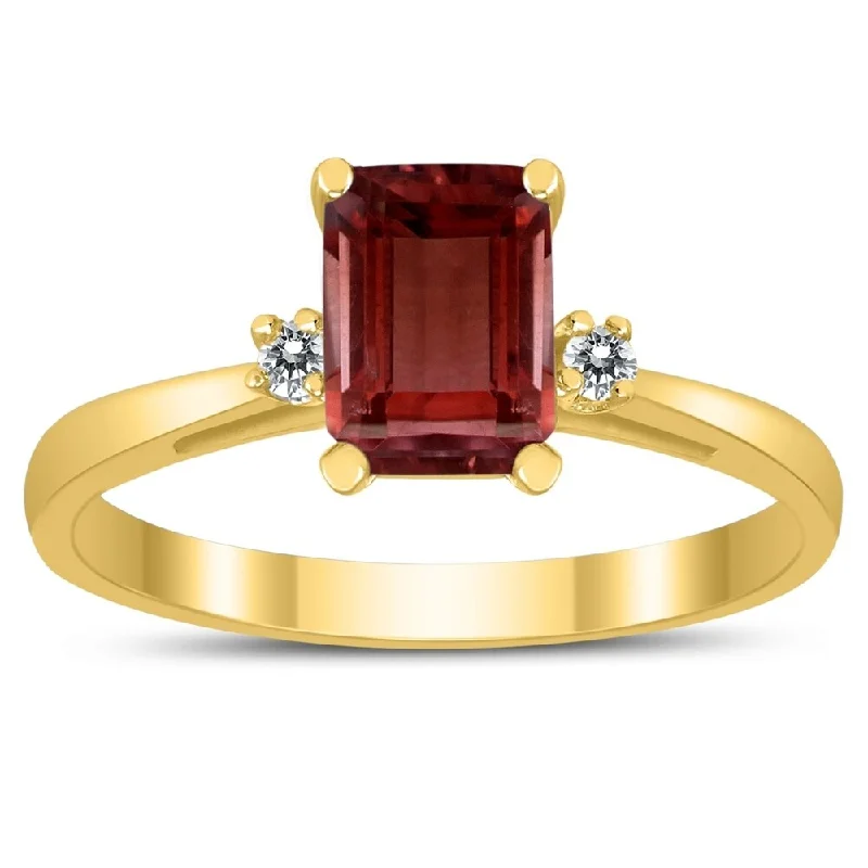 Emerald Cut 7X5MM Garnet and Diamond Three Stone Ring in 10K Yellow Gold