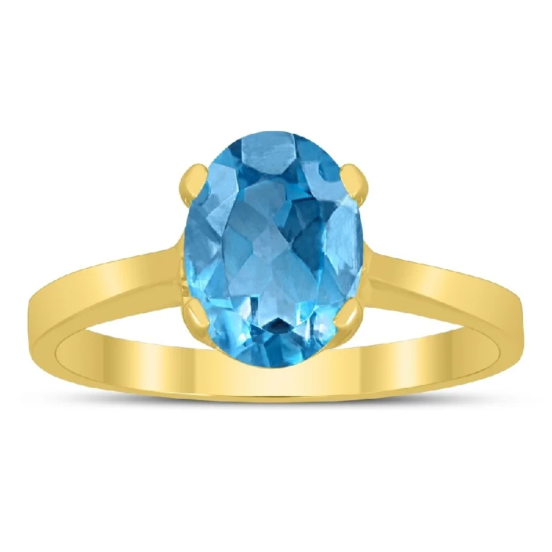 Oval Solitaire 8X6MM Blue Topaz Ring in 10K Yellow Gold