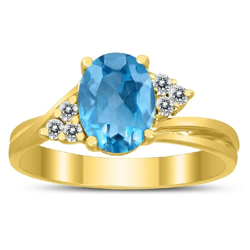 8X6MM Blue Topaz and Diamond Twist Ring in 10K Yellow Gold