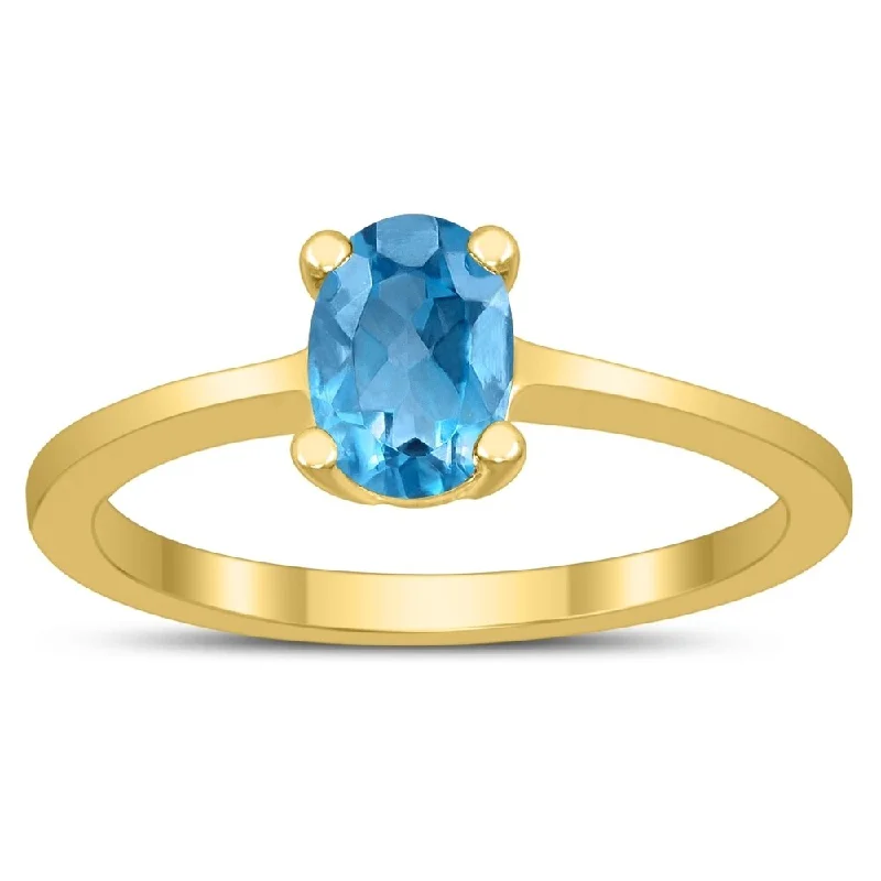 Oval Solitaire 7X5MM Blue Topaz Ring in 10K Yellow Gold